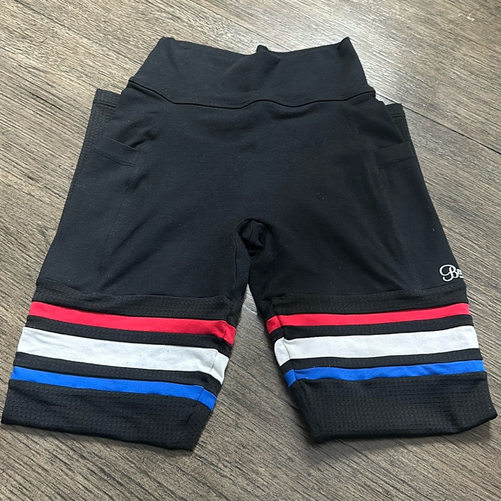 Bombshell Leggings. Good condition. White strip is sligh faded. Non smoke home